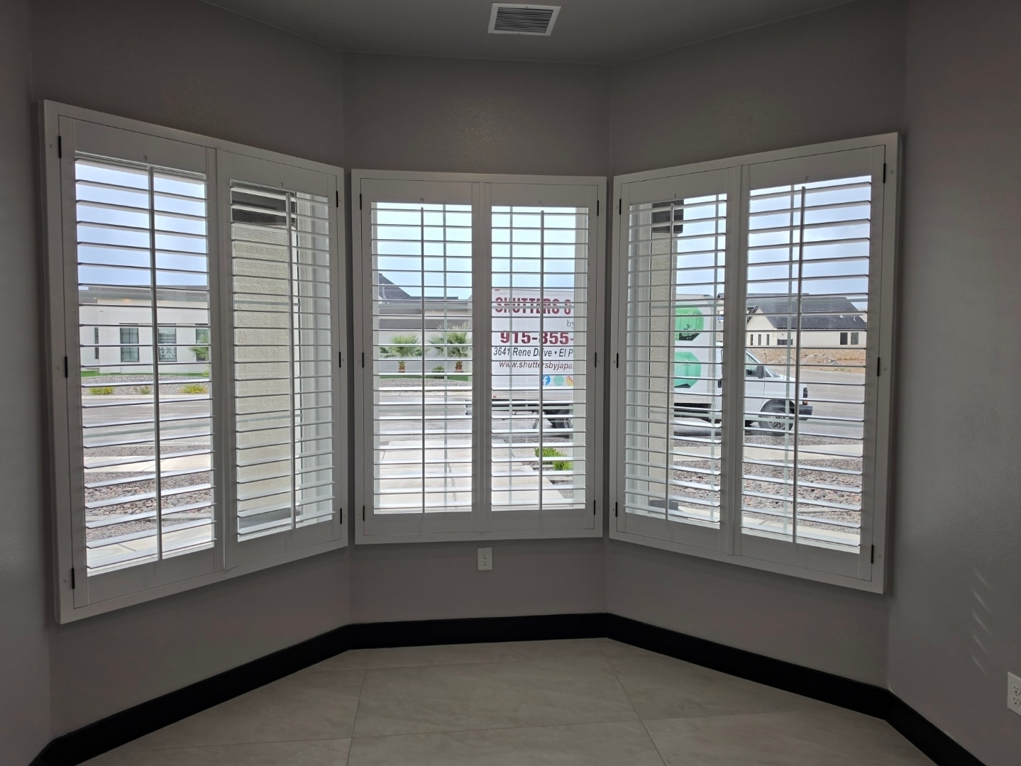 Plantation shutters on a curved bay window