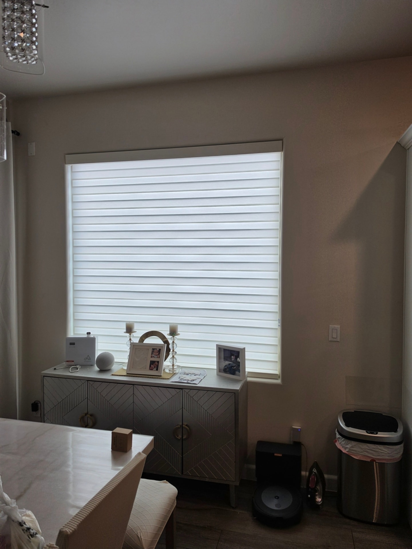 White zebra shades on a dining room window