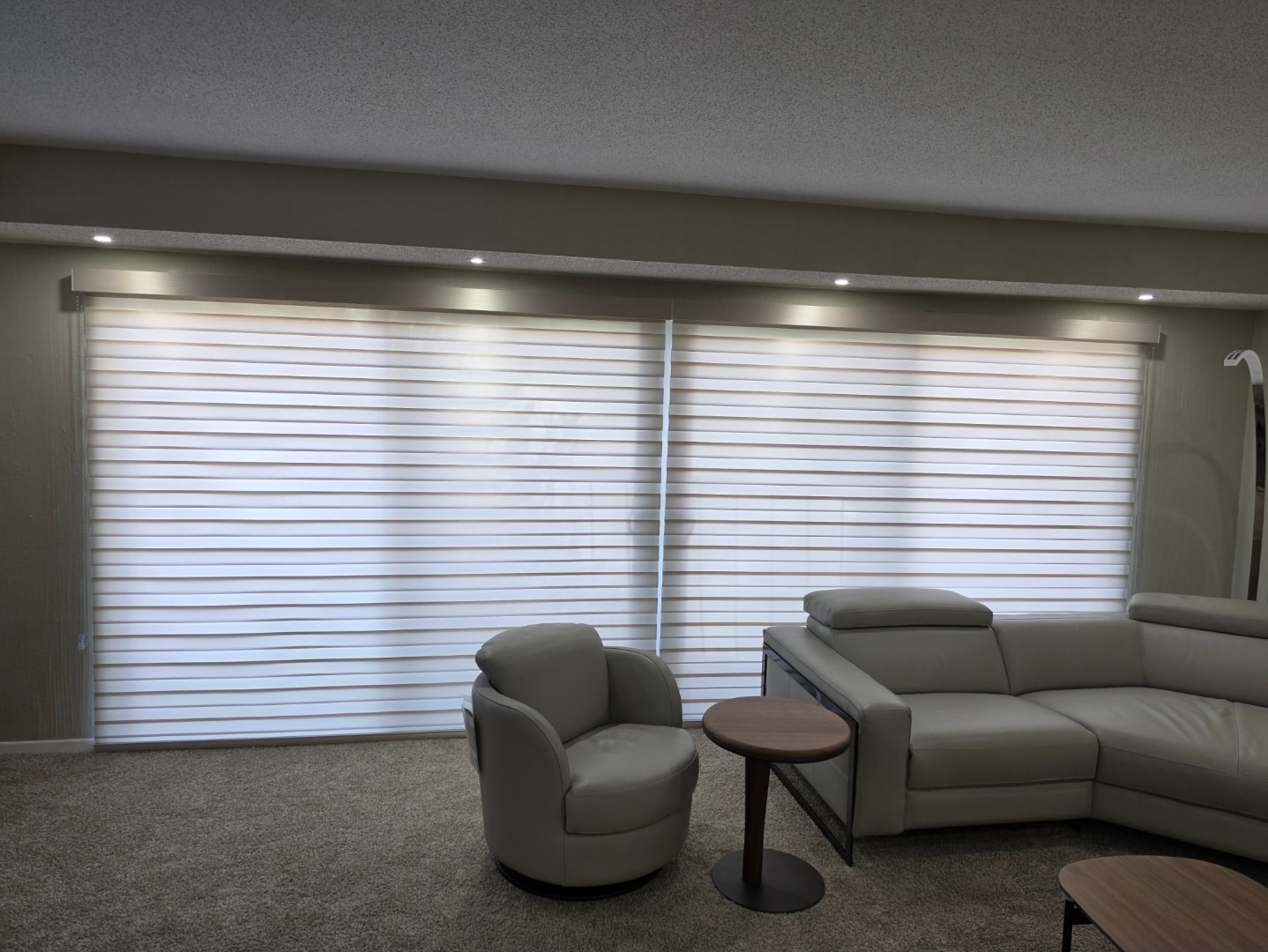 White zebra shades on a wide living room window